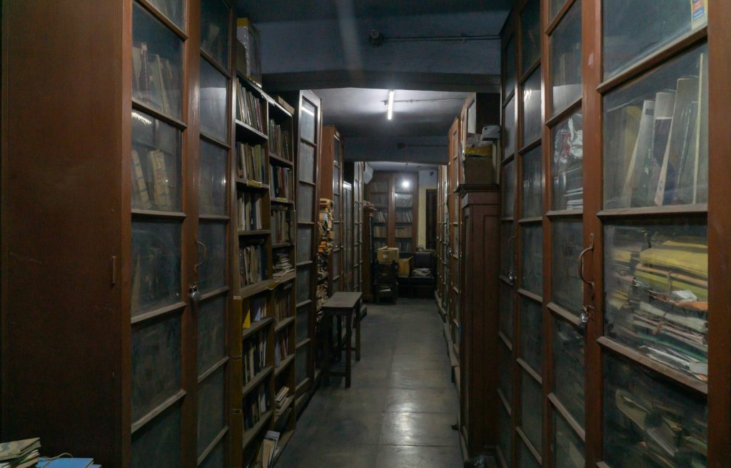 Shelves of books in a library reading room
