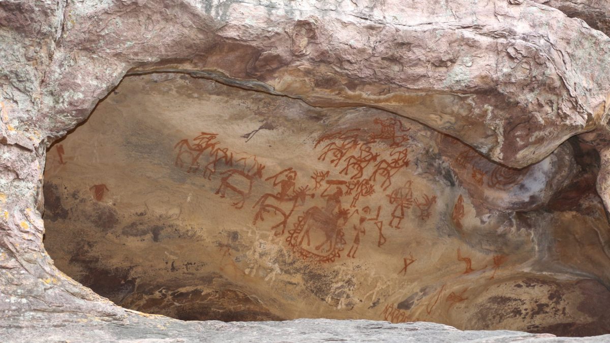 A sandstone rock shelter at Bhimbetka with prehistoric paintings on its wall