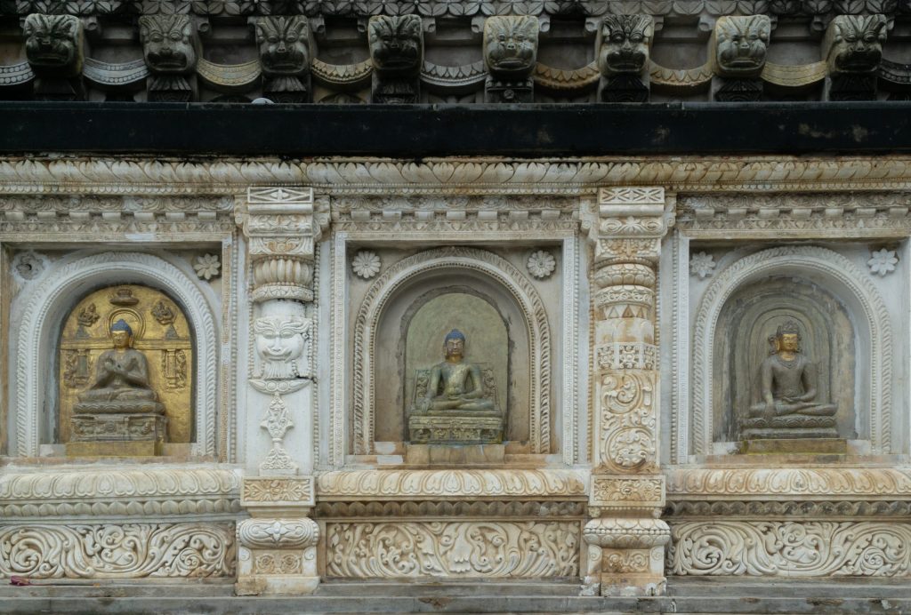 Carved niches with images of the Buddha on the south wall of the Mahabodhi Temple at Bodh Gaya