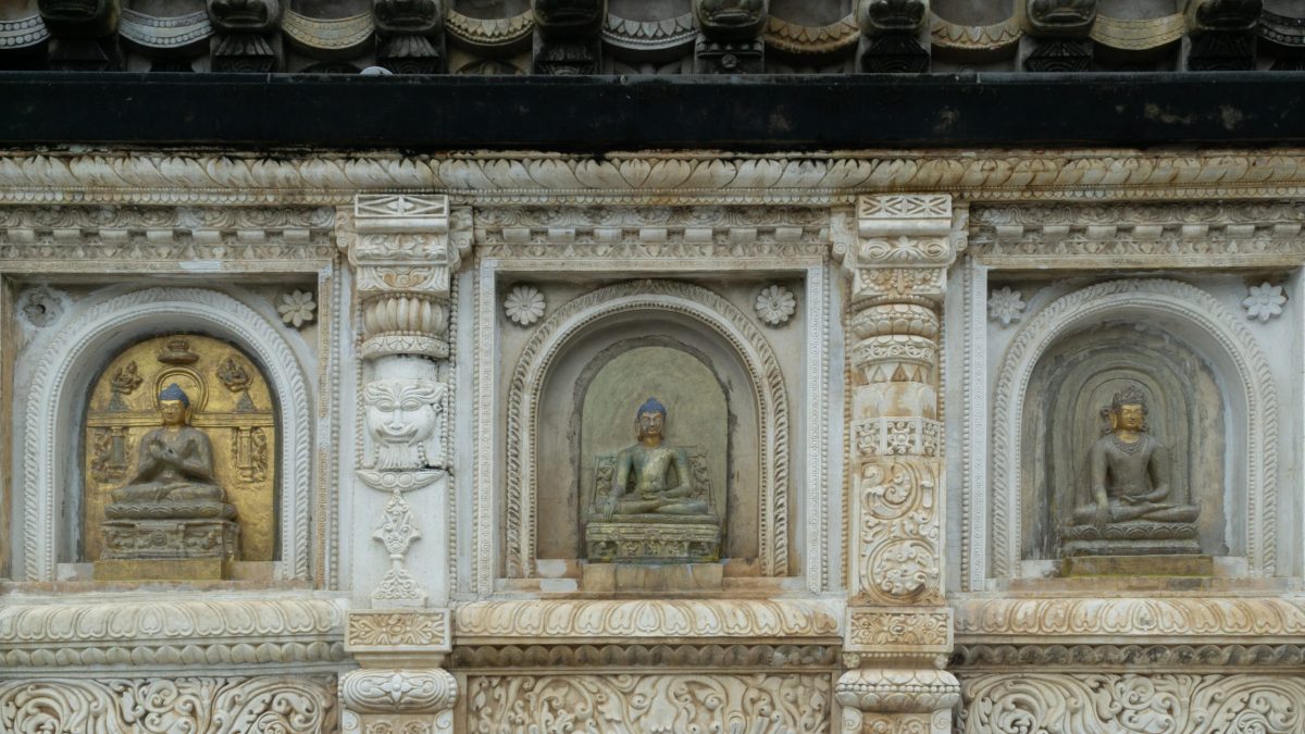 Carved niches with images of the Buddha on the south wall of the Mahabodhi Temple at Bodh Gaya