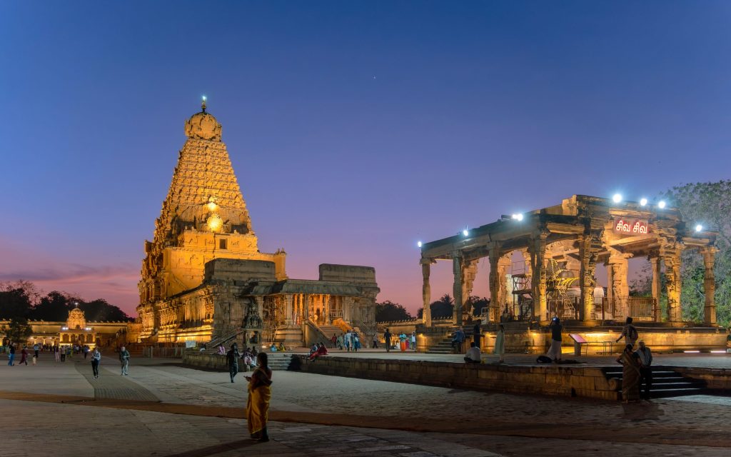 The towering granite vimana of the Brihadisvara Temple at Thanjavur lit up during a festival