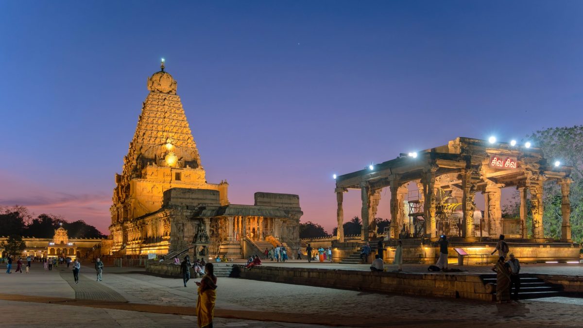 The towering granite vimana of the Brihadisvara Temple at Thanjavur lit up during a festival