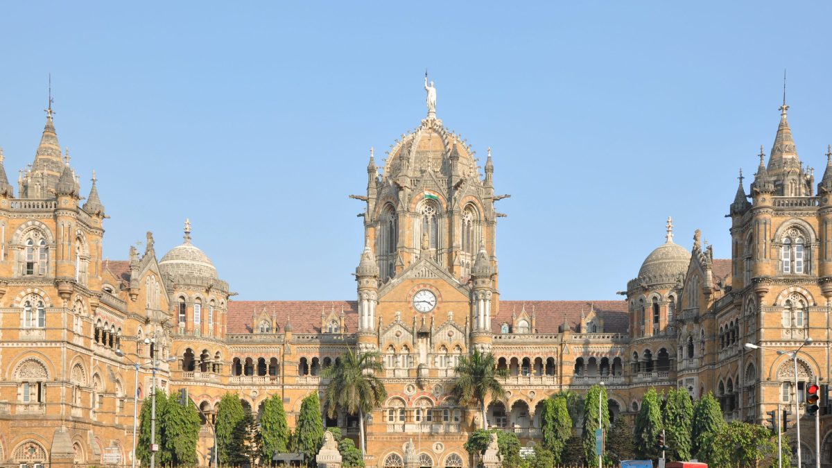 The ornate Victorian Gothic facade and central dome of Chhatrapati Shivaji Maharaj Terminus in Mumbai