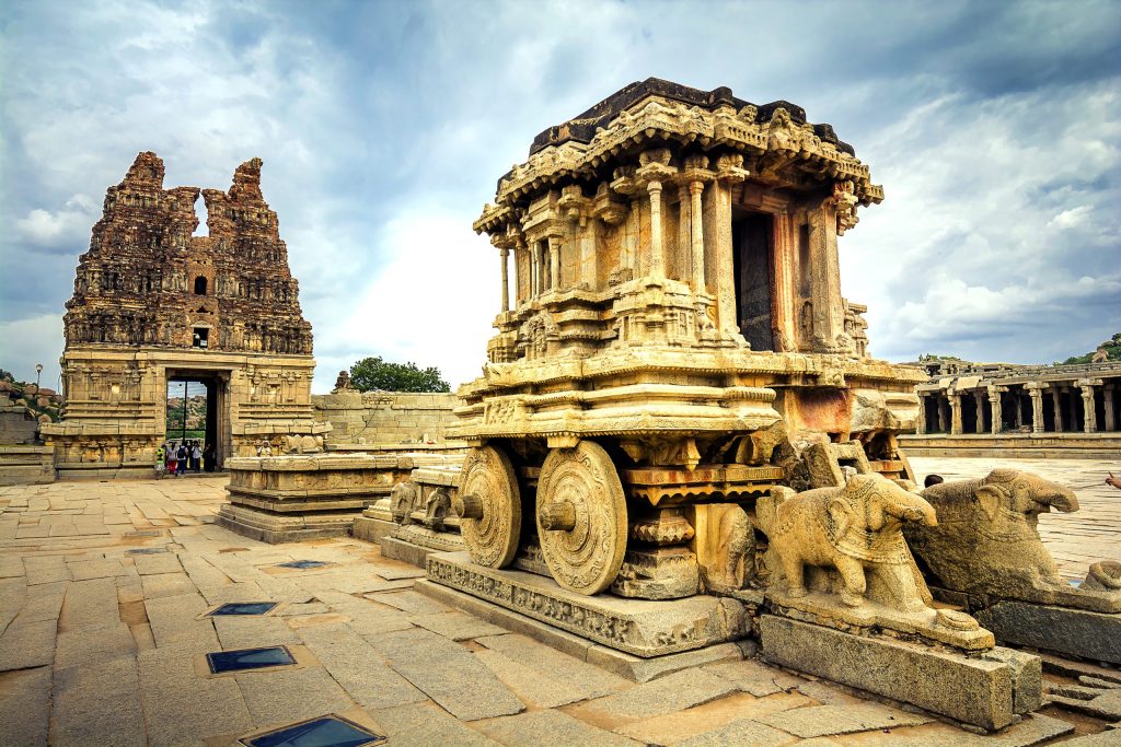 The carved stone chariot standing in the courtyard of the Vittala Temple at Hampi