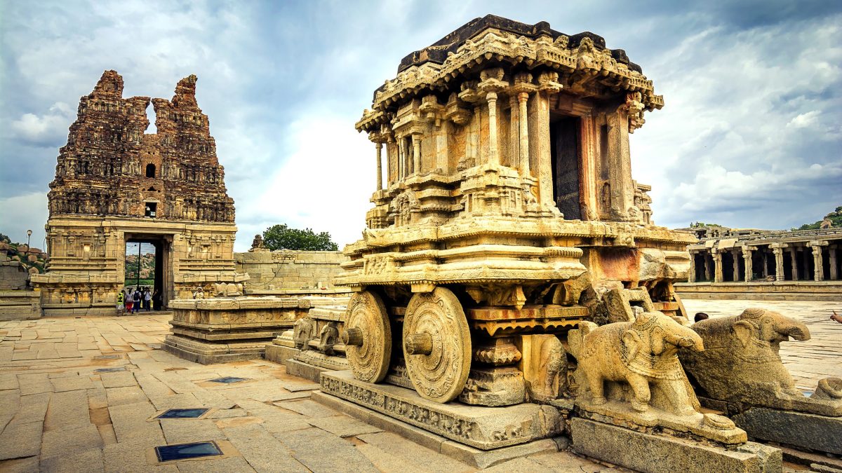 The carved stone chariot standing in the courtyard of the Vittala Temple at Hampi