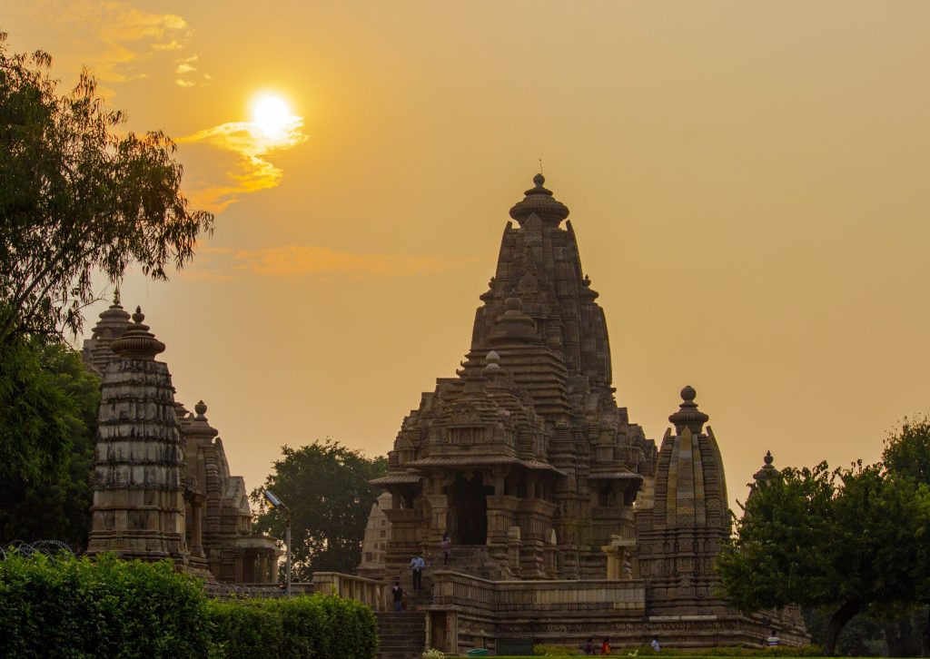 The tall sandstone spire and carved walls of the Kandariya Mahadeva Temple at Khajuraho