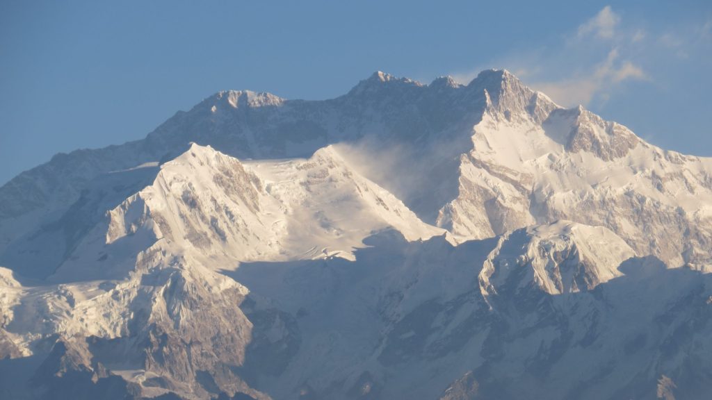 The snow-covered massif of Kangchenjunga seen from Sikkim under a clear sky