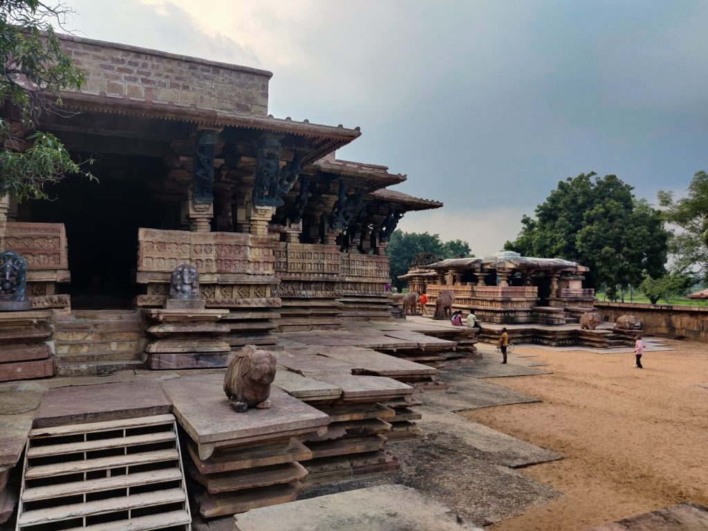 The sandstone Ramappa Temple with its stepped brick tower standing on a star-shaped platform