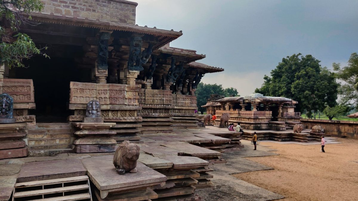 The sandstone Ramappa Temple with its stepped brick tower standing on a star-shaped platform