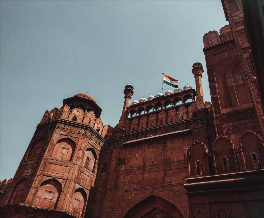 The red sandstone Lahori Gate of the Red Fort in Delhi with the national flag flying above it