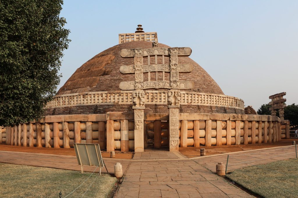 The hemispherical dome of the Great Stupa at Sanchi with its stone railing and carved gateway