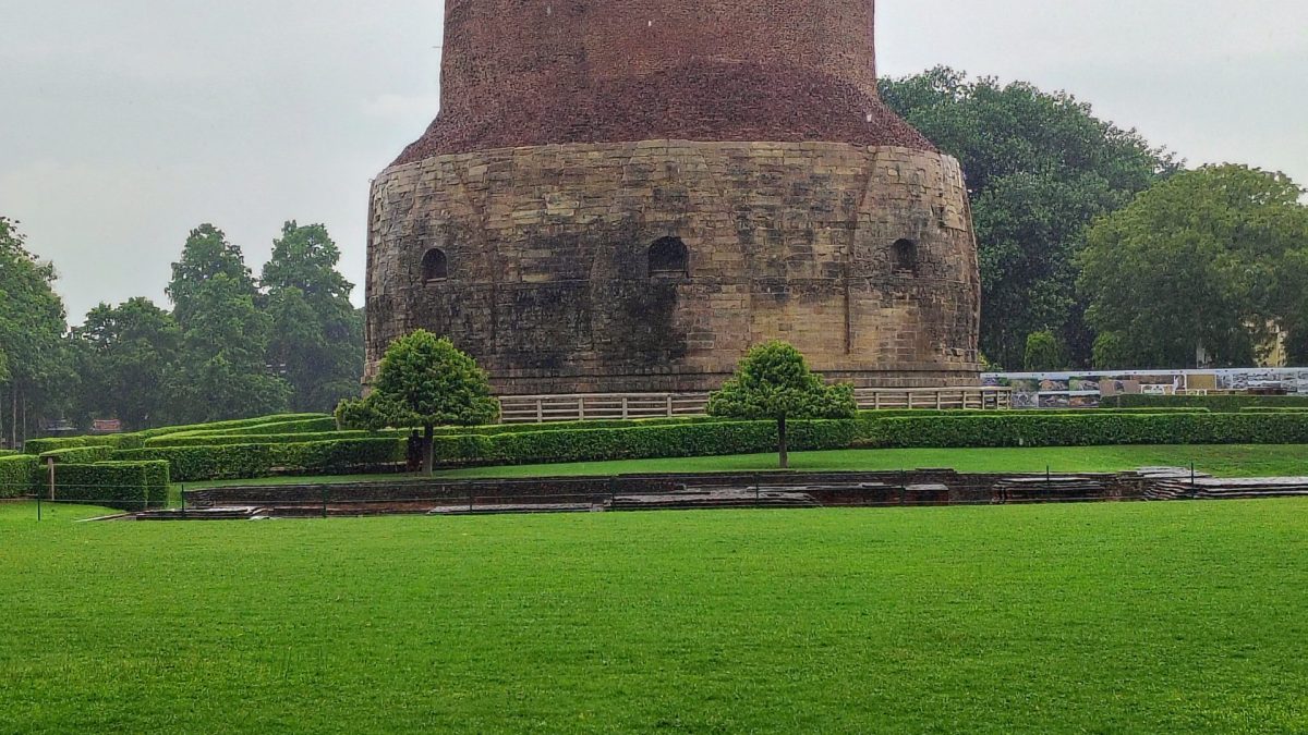 The massive cylindrical Dhamek Stupa at Sarnath built of brick and carved stone