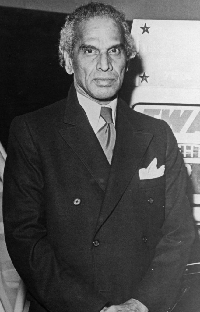Black-and-white photograph of V. K. Krishna Menon in a dark suit with a pocket handkerchief