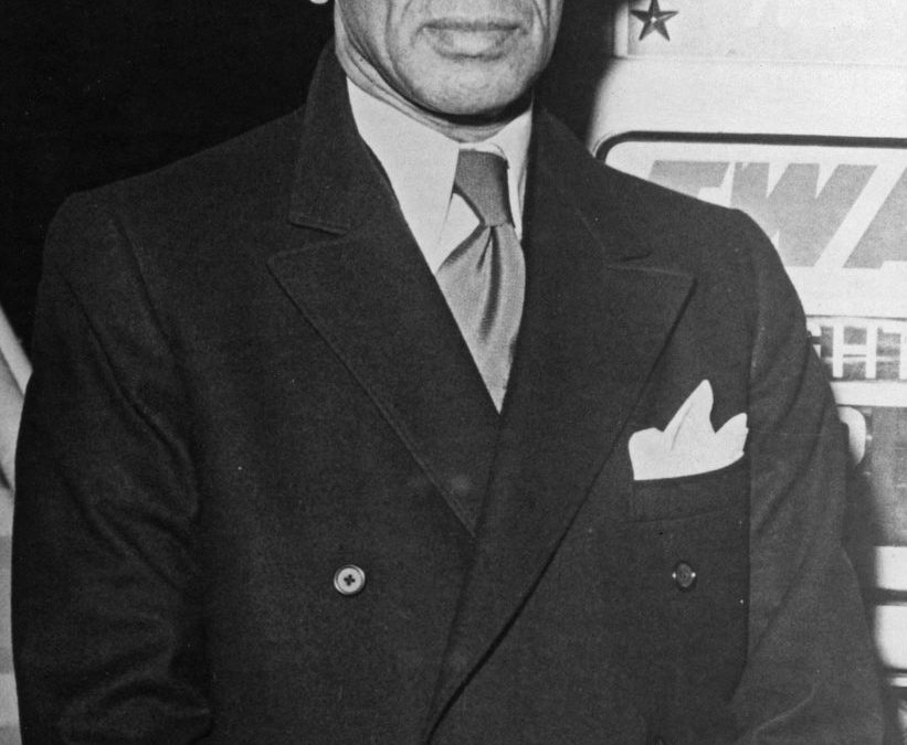 Black-and-white photograph of V. K. Krishna Menon in a dark suit with a pocket handkerchief