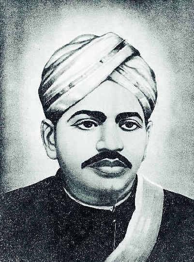 A black-and-white portrait of V. O. Chidambaram Pillai in a turban, with a moustache