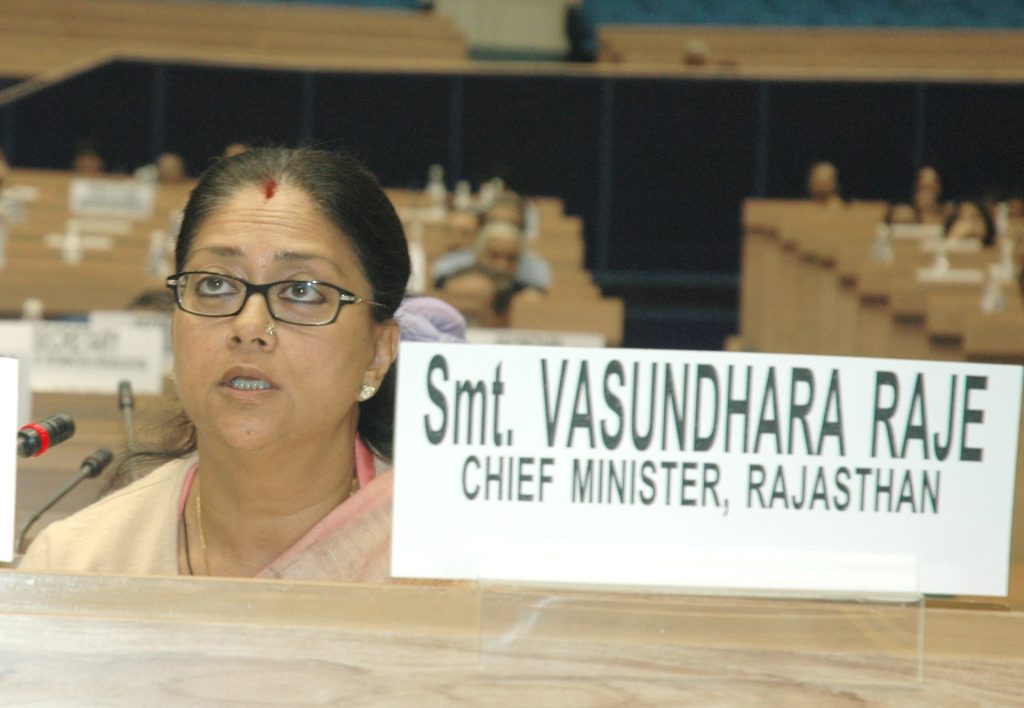 Vasundhara Raje in glasses speaking at a National Development Council meeting