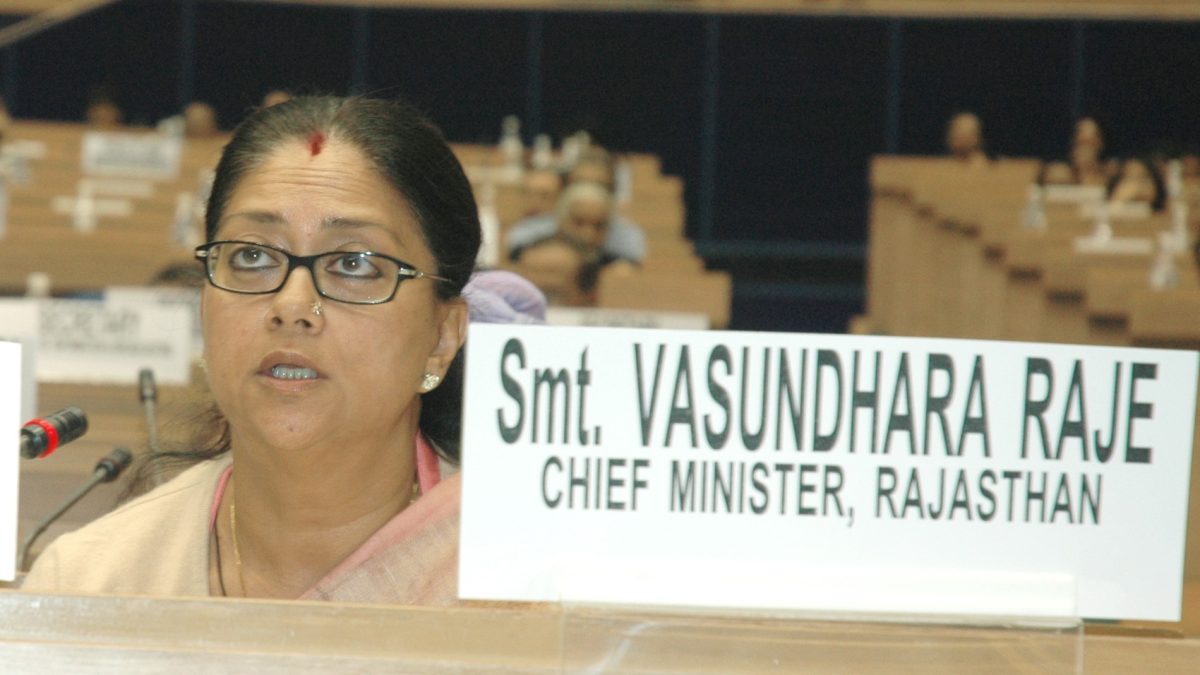 Vasundhara Raje in glasses speaking at a National Development Council meeting