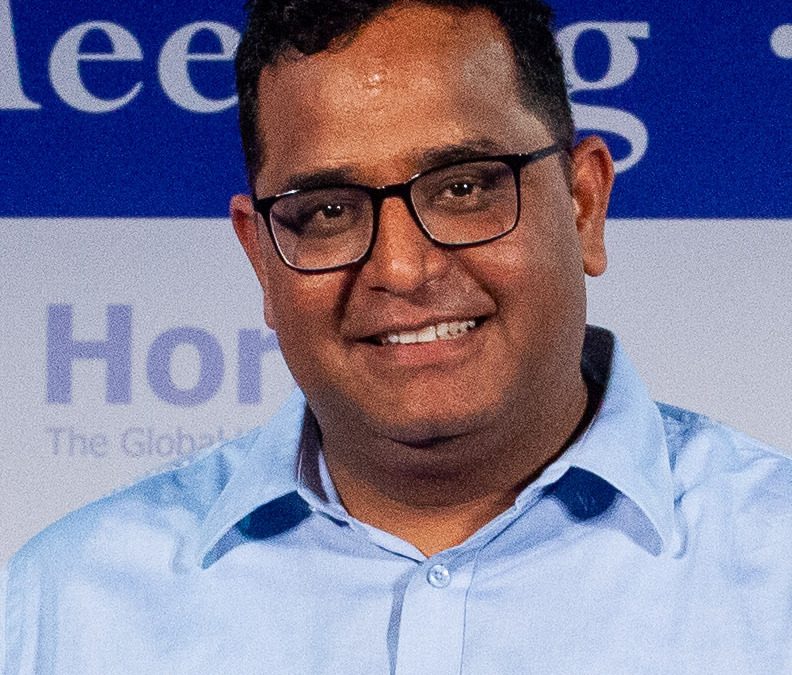 Vijay Shekhar Sharma in glasses and a light blue shirt, smiling