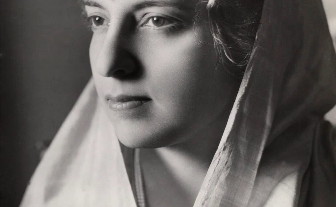 Studio portrait of Vijaya Lakshmi Pandit in profile with a white sari over her head