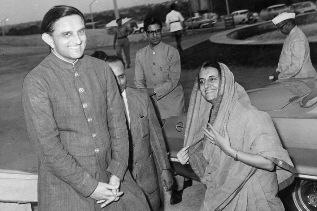 Vikram Sarabhai smiling as he greets Prime Minister Indira Gandhi