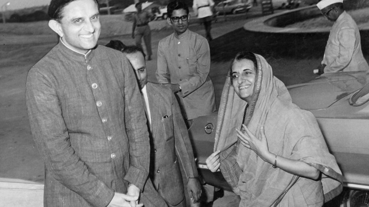 Vikram Sarabhai smiling as he greets Prime Minister Indira Gandhi