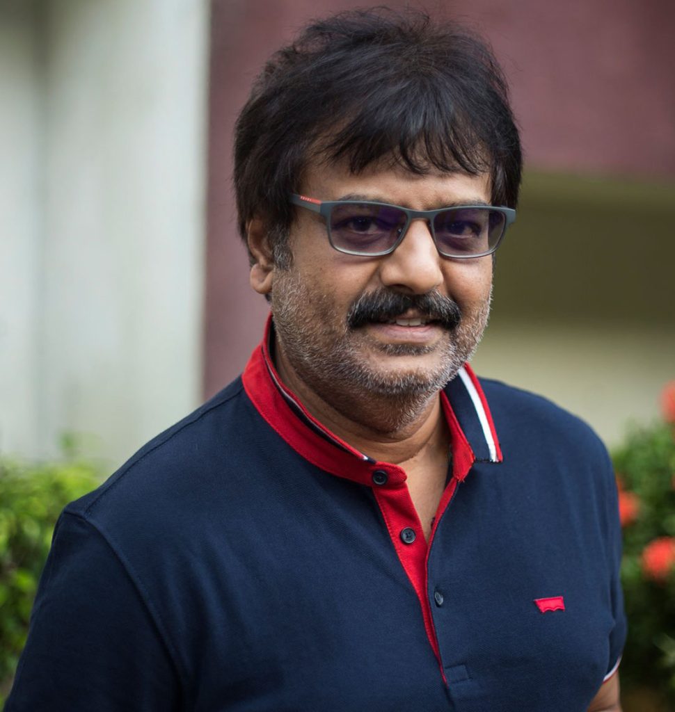 Vivek in tinted glasses and a navy polo shirt