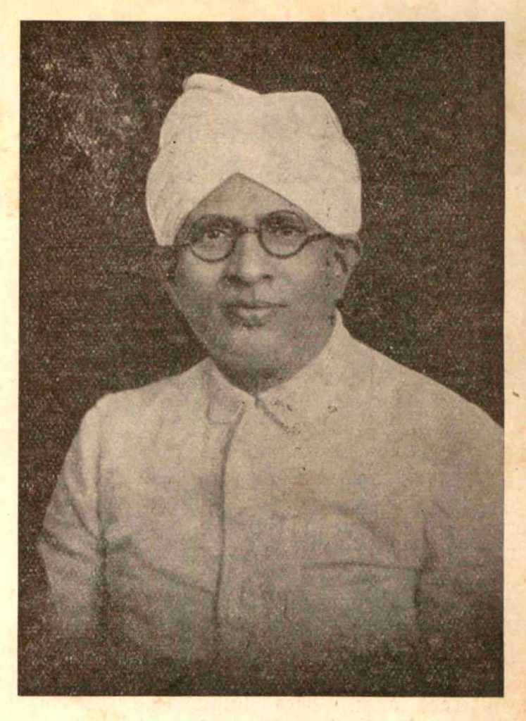 An old portrait of Walchand Hirachand in a turban and glasses